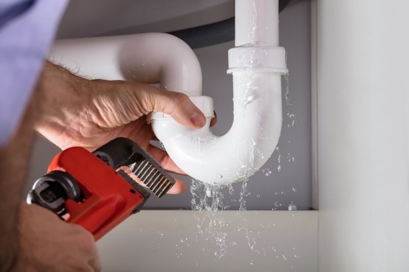 Handyman Fixing a Leaking Faucet
